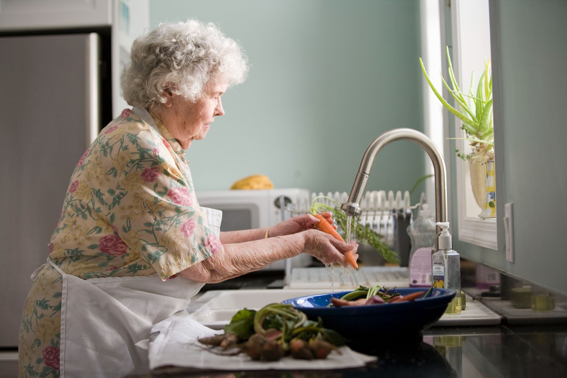 older lady washing food